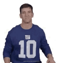 A Man Wearing A Blue New York Giants Jersey Is Standing In Front Of A White Background . GIF