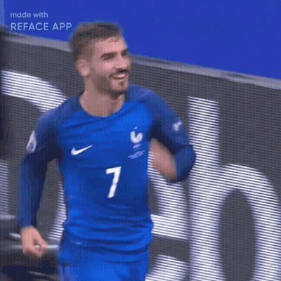 A Man Wearing A Blue Nike Jersey Is Holding A Soccer Ball In His Hands GIF