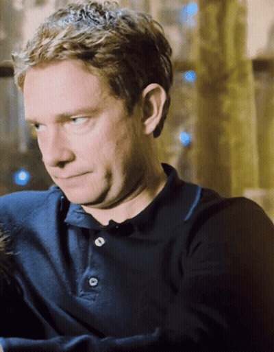 A Man Wearing A Blue Polo Shirt With Buttons On It GIF
