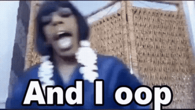 A Man Wearing A Blue Shirt And A Lei Says `` And I Loop '' While Standing In Front Of A Wall . GIF