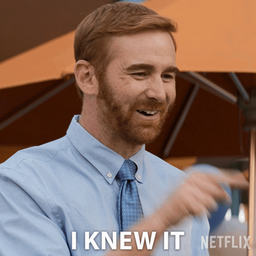 A Man Wearing A Blue Shirt And Tie Says I Knew It GIF