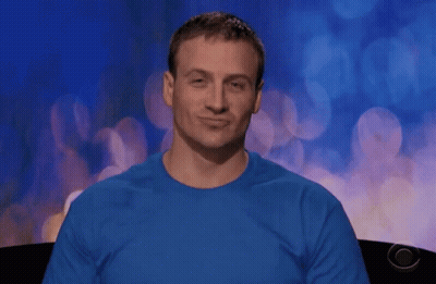 A Man Wearing A Blue Shirt Is Making A Face GIF