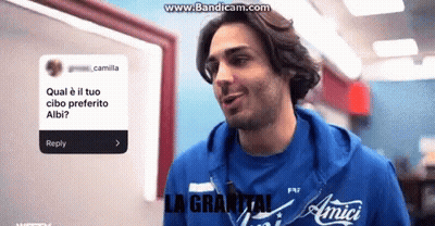 A Man Wearing A Blue Shirt That Says Amici GIF