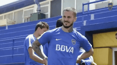 A Man Wearing A Blue Shirt That Says Bbva On The Front GIF
