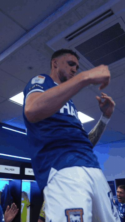 A Man Wearing A Blue Shirt That Says ' Ha ' On It GIF
