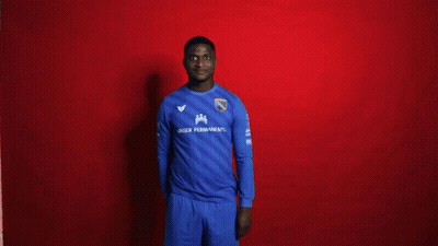 A Man Wearing A Blue Shirt That Says Hauser Permanent On It GIF