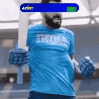 A Man Wearing A Blue Shirt That Says India GIF