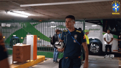 A Man Wearing A Blue Shirt That Says Itau On It GIF
