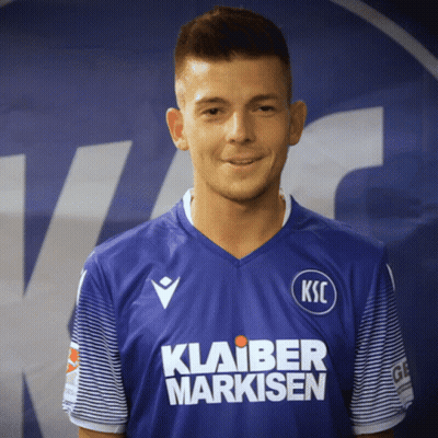 A Man Wearing A Blue Shirt That Says Ksc On The Front GIF