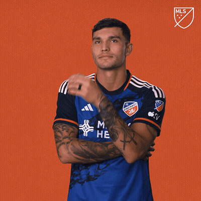 A Man Wearing A Blue Shirt That Says Men 'S Health GIF