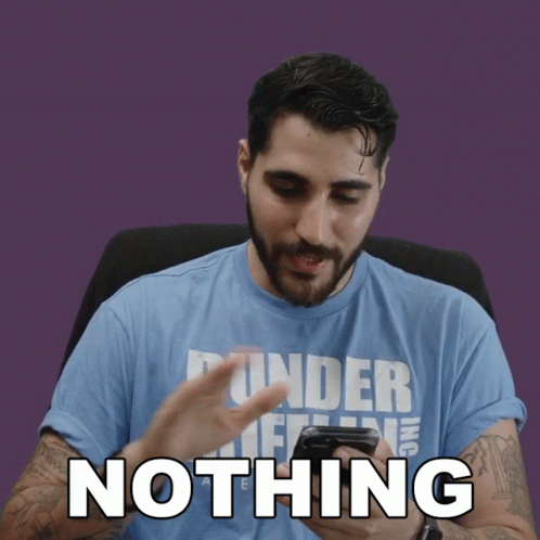 A Man Wearing A Blue Shirt That Says Nothing Looks At His Phone GIF