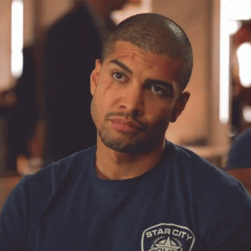 A Man Wearing A Blue Shirt That Says Star City On The Front GIF