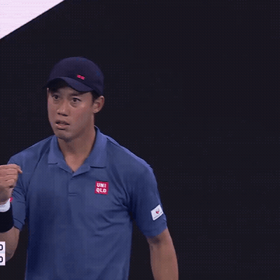 A Man Wearing A Blue Shirt That Says Uniqlo On The Sleeve GIF