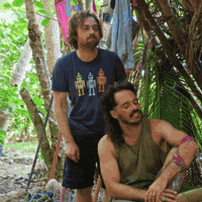A Man Wearing A Blue Shirt With Robots On It GIF