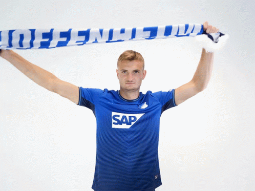 A Man Wearing A Blue Shirt With Sap On It GIF