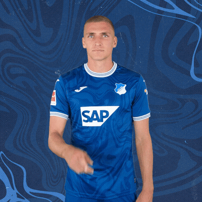 A Man Wearing A Blue Shirt With Sap On It GIF