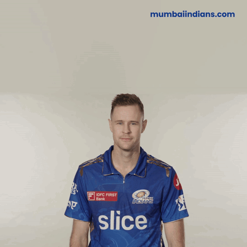 A Man Wearing A Blue Shirt With Slice On It GIF