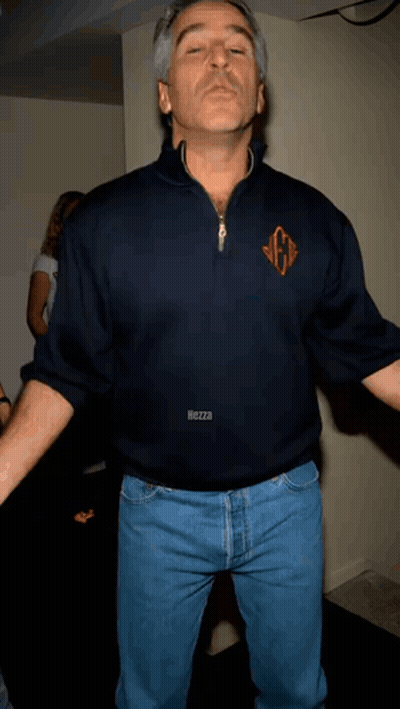 A Man Wearing A Blue Shirt With The Letter G On The Front GIF