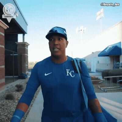 A Man Wearing A Blue Shirt With The Letter Kc On The Front GIF
