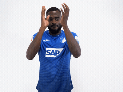 A Man Wearing A Blue Shirt With The Letter P On The Sleeve Is Clapping His Hands GIF