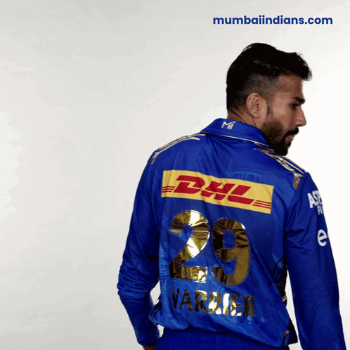 A Man Wearing A Blue Shirt With The Number 29 On The Back GIF