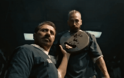 A Man Wearing A Blue Shirt With The Number 666 On It GIF