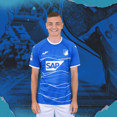 A Man Wearing A Blue Shirt With The Word Sap On The Front GIF