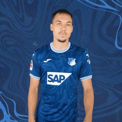 A Man Wearing A Blue Shirt With The Word Sap On The Front GIF
