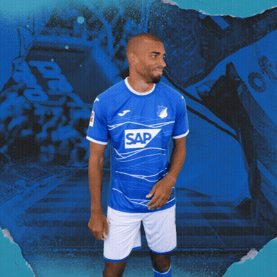 A Man Wearing A Blue Shirt With The Word Sap On The Front GIF