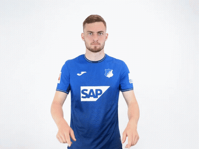 A Man Wearing A Blue Shirt With The Word Sap On The Front GIF