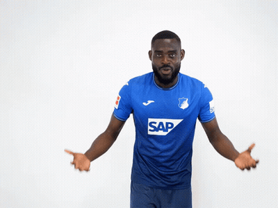 A Man Wearing A Blue Shirt With The Word Sap On The Front GIF