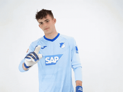 A Man Wearing A Blue Shirt With The Word Sap On The Front GIF