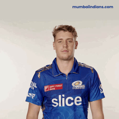 A Man Wearing A Blue Shirt With The Word Slice On The Front GIF