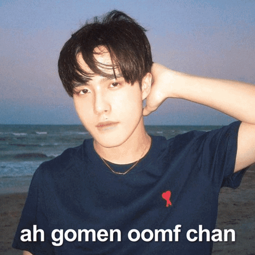 A Man Wearing A Blue Shirt With The Words Ah Gomen Oomf Chan Written On It GIF