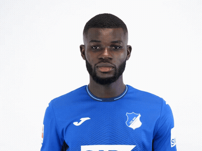 A Man Wearing A Blue Shirt With Tsg 1899 Written On It GIF