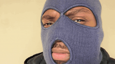 A Man Wearing A Blue Ski Mask With A Hole In The Middle Of His Face GIF