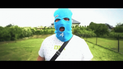 A Man Wearing A Blue Ski Mask With The Number Four On It GIF