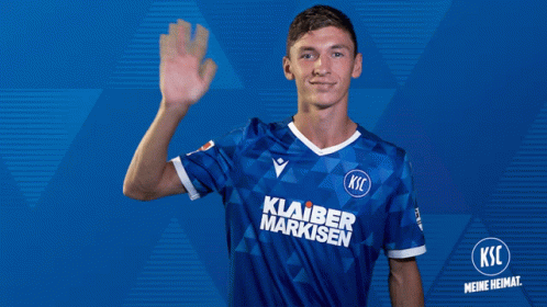 A Man Wearing A Blue Soccer Jersey That Says Klaber Markisen GIF