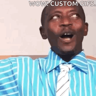 A Man Wearing A Blue Striped Shirt And Tie Is Making A Surprised Face . GIF