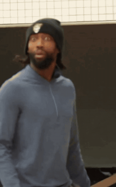 A Man Wearing A Blue Sweater And A Black Beanie GIF