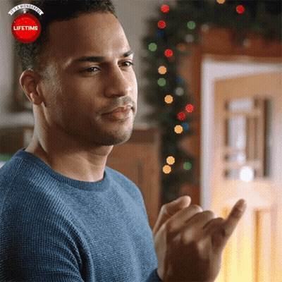 A Man Wearing A Blue Sweater Is Clapping His Hands In Front Of A Lifetime Logo GIF