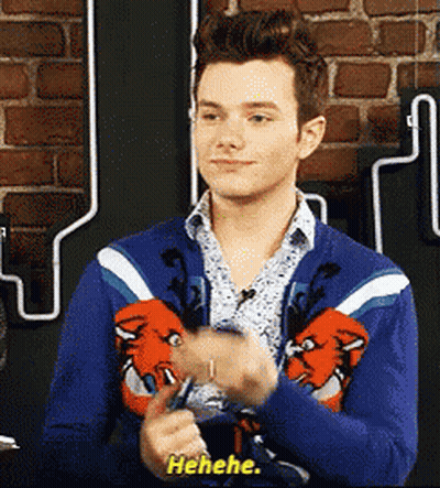 A Man Wearing A Blue Sweater Is Laughing And Says ' Ahehe ' GIF