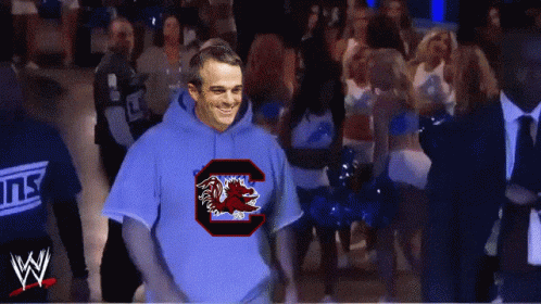 A Man Wearing A Blue Sweatshirt With A C On It GIF