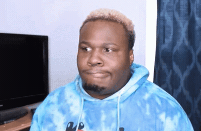 A Man Wearing A Blue Tie Dye Hoodie Looks To The Side GIF