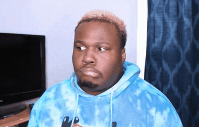 A Man Wearing A Blue Tie Dye Hoodie With A Knife On The Front GIF