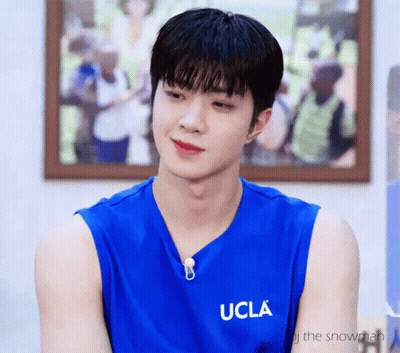 A Man Wearing A Blue Ucla Tank Top GIF