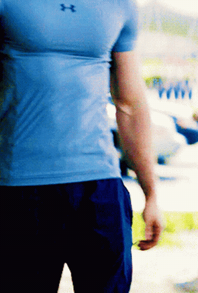 A Man Wearing A Blue Under Armour Shirt And Blue Shorts GIF