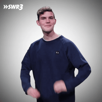A Man Wearing A Blue Under Armour Sweatshirt Is Dancing In Front Of A Swr3 Logo GIF
