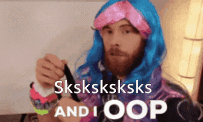 A Man Wearing A Blue Wig And A Pink Headband Says Sksksksksks And I Oops GIF