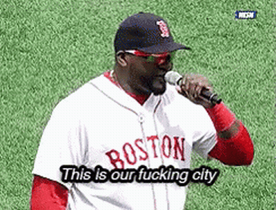 A Man Wearing A Boston Jersey Is Holding A Microphone GIF